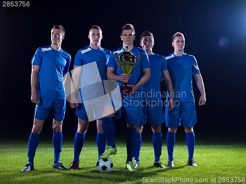 Image of soccer players celebrating victory