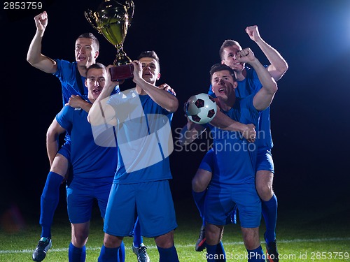 Image of soccer players celebrating victory