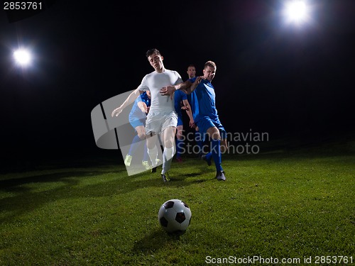 Image of soccer players duel