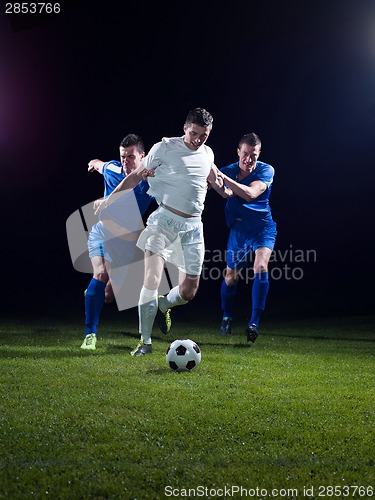 Image of soccer players duel