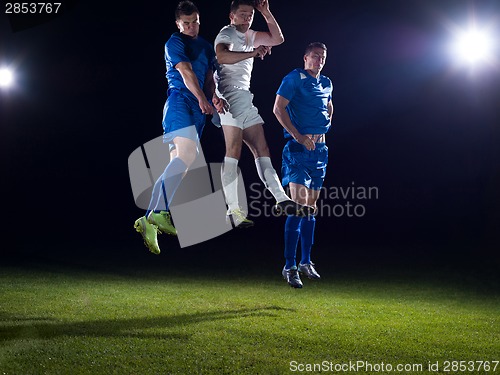 Image of soccer players duel