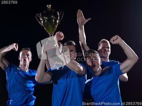 Image of soccer players celebrating victory