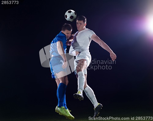 Image of soccer players duel