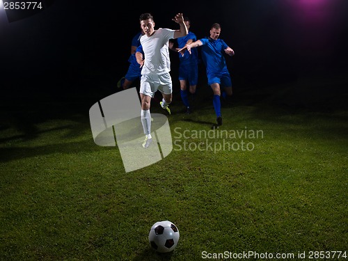 Image of soccer players duel