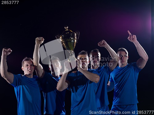 Image of soccer players celebrating victory