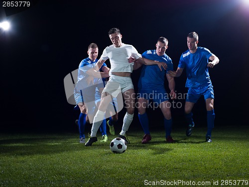 Image of soccer players duel