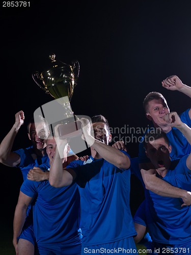 Image of soccer players celebrating victory