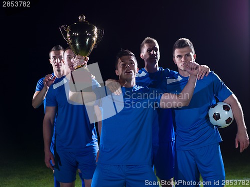 Image of soccer players celebrating victory