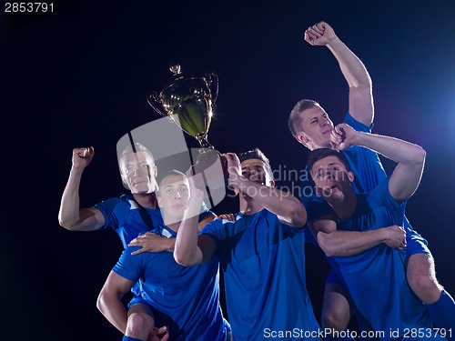 Image of soccer players celebrating victory