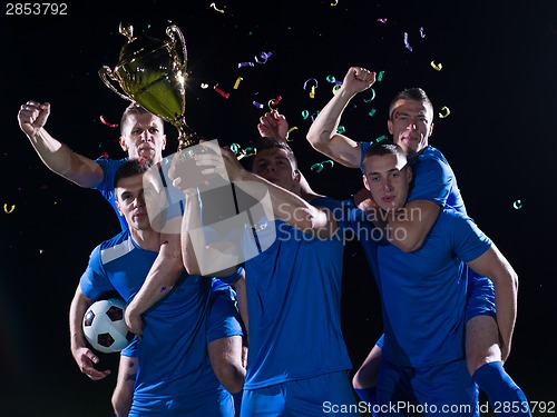 Image of soccer players celebrating victory