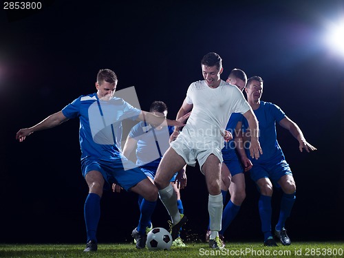 Image of soccer players duel