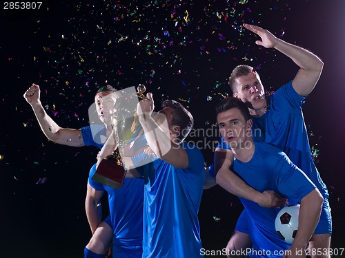 Image of soccer players celebrating victory