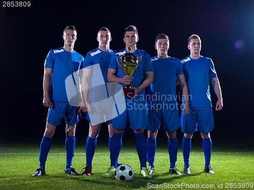 Image of soccer players celebrating victory