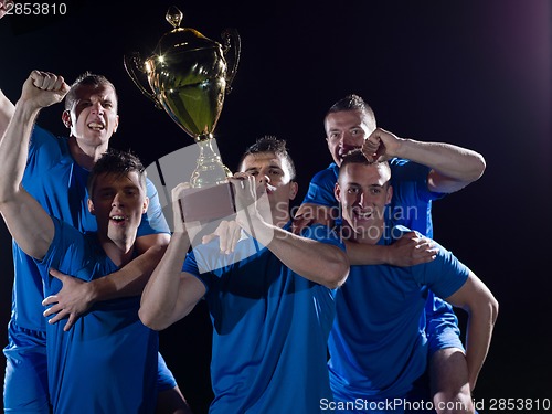 Image of soccer players celebrating victory