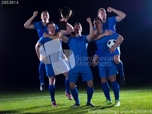 Image of soccer players celebrating victory