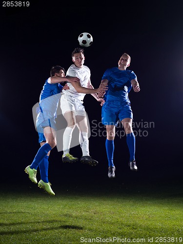 Image of soccer players duel