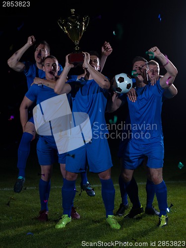 Image of soccer players celebrating victory