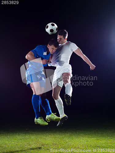 Image of soccer players duel