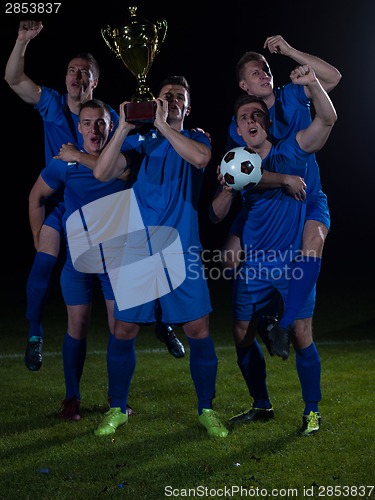 Image of soccer players celebrating victory