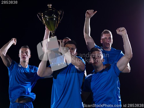 Image of soccer players celebrating victory