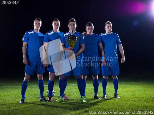 Image of soccer players celebrating victory