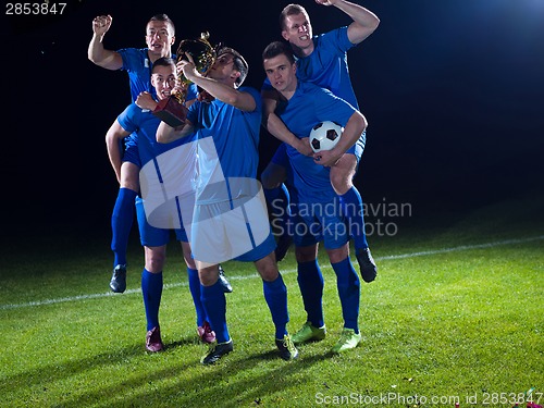 Image of soccer players celebrating victory