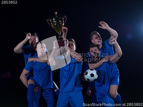 Image of soccer players celebrating victory