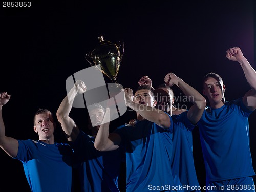 Image of soccer players celebrating victory