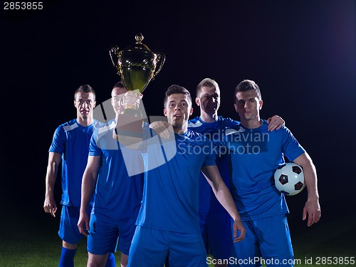 Image of soccer players celebrating victory