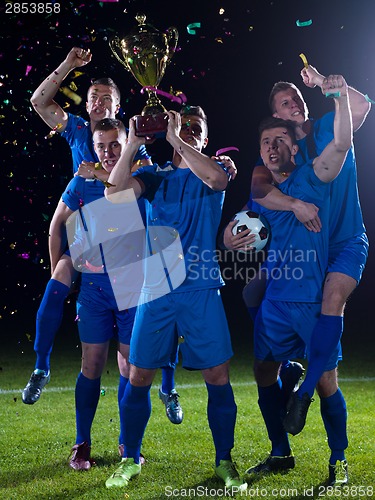 Image of soccer players celebrating victory