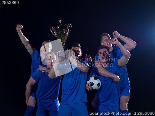 Image of soccer players celebrating victory