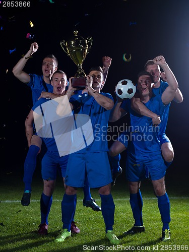 Image of soccer players celebrating victory