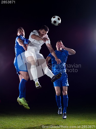 Image of soccer players duel