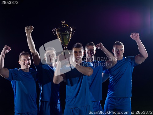 Image of soccer players celebrating victory