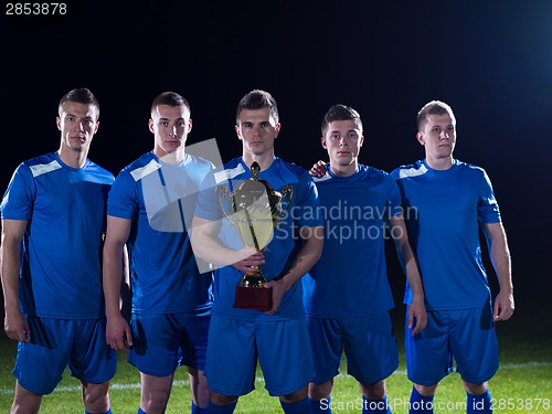 Image of soccer players celebrating victory