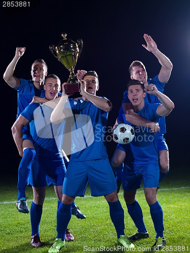 Image of soccer players celebrating victory