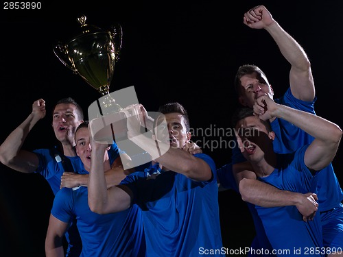 Image of soccer players celebrating victory