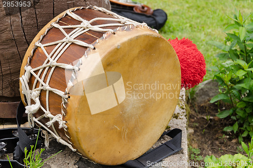 Image of leather drum with African motifs outdoor 
