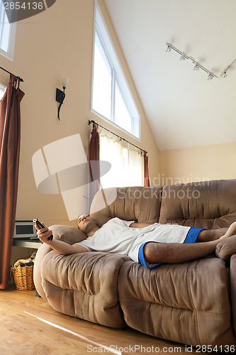 Image of Lazy Man Laying on the Sofa