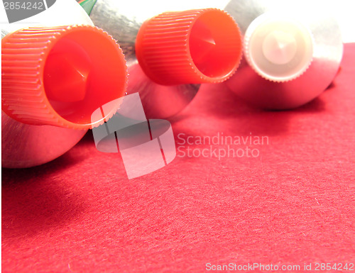 Image of Three sealed tubes on a red placemat