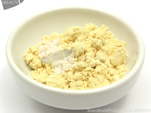 Image of Soy meal in a little white bowl of chinaware on white