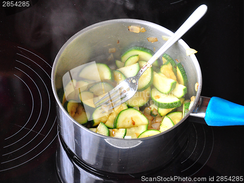 Image of Vegetable on the hot plate while frying