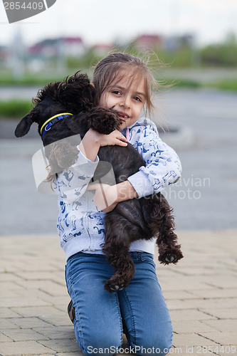 Image of Little girl with her dog