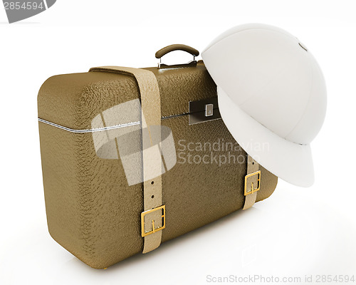 Image of Brown traveler's suitcase and peaked cap 