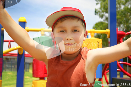 Image of Child on bright playground equipment