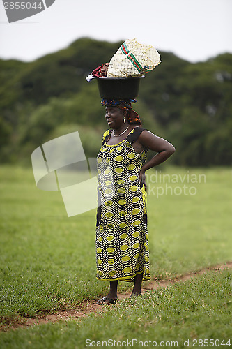 Image of Portrait of an african lady wearing things on her head