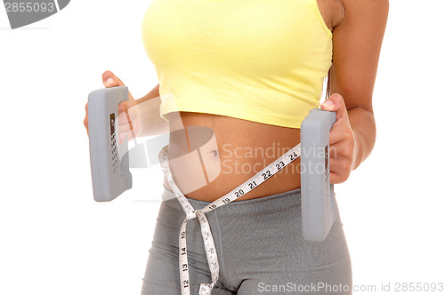 Image of Closeup of girl with weights.