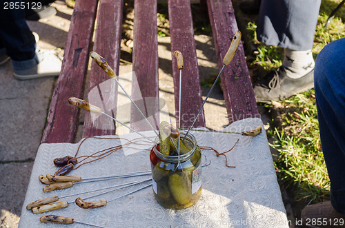 Image of handmade metal spit to pull of jar vegetable 