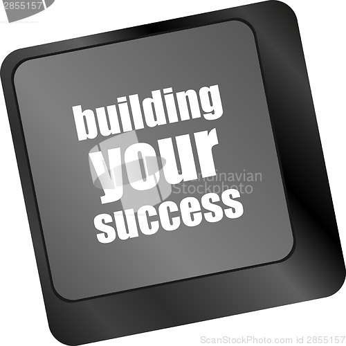 Image of building your success words on button or key showing motivation for job or business