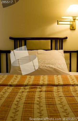 Image of Single bed in a hotel suite room

